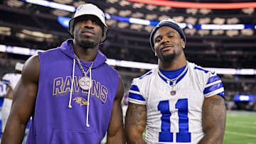 Dallas Cowboys defensive end Micah Parsons poses for a photo with Baltimore Ravens linebacker Odafe Oweh after the game
