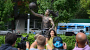 Aug 17, 2025; Seattle, Washington, USA; Former Seattle Storm player, Sue Bird, poses for a photo in front of her statue prior to the game between the Seattle Storm and the Phoenix Mercury at Climate Pledge Arena. Mandatory Credit: Steven Bisig-Imagn Images