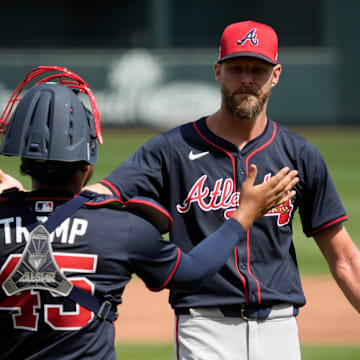 Atlanta Braves pitcher Chris Sale high-fives catcher Chadwick Tromp following a pitching session during spring training Thursday, Feb. 27th at CoolToday Park in North Port.