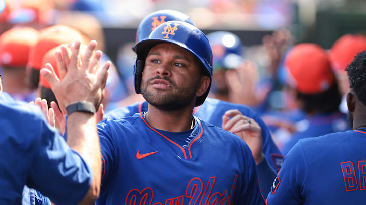 Feb 27, 2026; Jupiter, Florida, USA; New York Mets first baseman Jose Rojas (81) celebrates after scoring against the St. Louis Cardinals during the fifth inning at Roger Dean Chevrolet Stadium. Mandatory Credit: Sam Navarro-Imagn Images