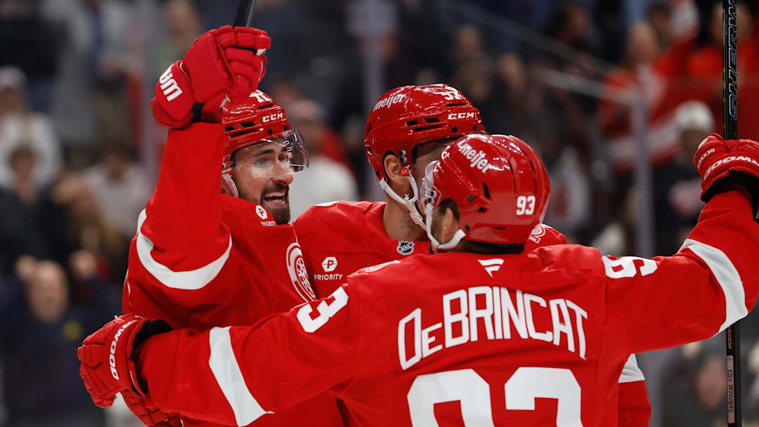Mar 28, 2026; Detroit, Michigan, USA;  Detroit Red Wings center Dylan Larkin (71) receives congratulations from teammates after scoring in the second period against the Philadelphia Flyers at Little Caesars Arena. Mandatory Credit: Rick Osentoski-Imagn Images
