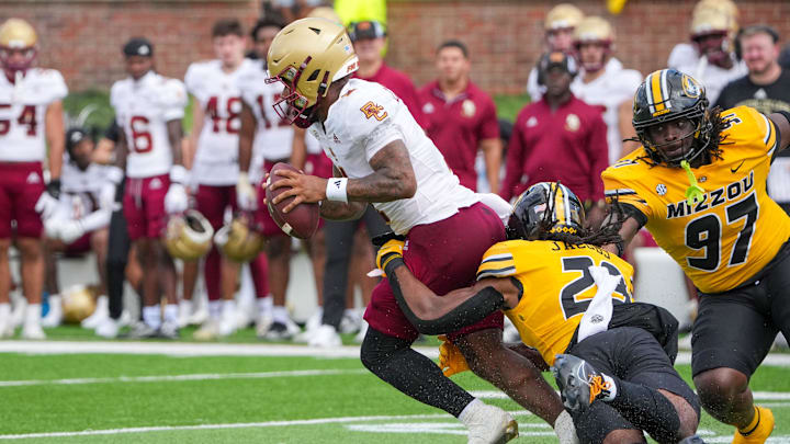 Sep 14, 2024; Columbia, Missouri, USA; Boston College Eagles quarterback Thomas Castellanos (1) is sacked by Missouri Tigers linebacker Khalil Jacobs (29) during the second half at Faurot Field at Memorial Stadium. Mandatory Credit: Denny Medley-Imagn Images