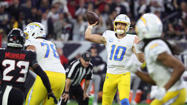 Jan 11, 2025; Houston, Texas, USA; Los Angeles Chargers quarterback Justin Herbert (10) looks to pass during the third quarte