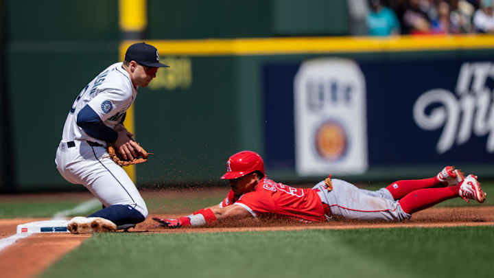 Angels left fielder Gustavo Campero (51) slides safely into third base before Seattle Mariners third baseman Ben Williamson (9) cant put on a tag during the second inning at T-Mobile Park on April 30. Angels left fielder Gustavo Campero (51) slides safely into third base before Seattle Mariners third baseman Ben Williamson (9) cant put on a tag during the second inning at T-Mobile Park on April 30.