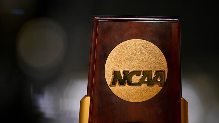 Apr 19, 2025; Fort Worth, TX, USA; A view of the NCAA logo and trophy before the 2025 Women's National Gymnastics Championship at Dickies Arena. Apr 19, 2025; Fort Worth, TX, USA; A view of the NCAA logo and trophy before the 2025 Women's National Gymnastics Championship at Dickies Arena.