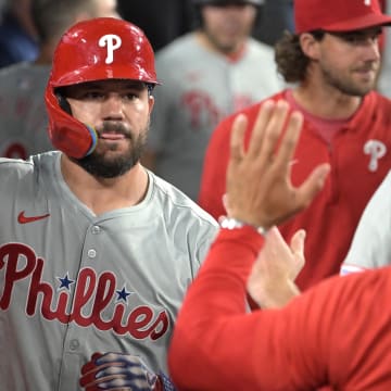  Philadelphia Phillies designated hitter Kyle Schwarber (12) is congratulated in the dugout after hitting a solo home run in the ninth inning against the Los Angeles Dodgers at Dodger Stadium on Aug 6.