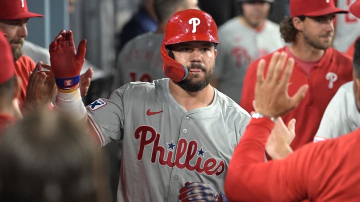  Philadelphia Phillies designated hitter Kyle Schwarber (12) is congratulated in the dugout after hitting a solo home run in the ninth inning against the Los Angeles Dodgers at Dodger Stadium on Aug 6.