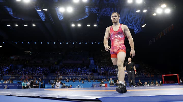 Aug 8, 2024; Paris, France; Spencer Richard Lee (USA) reacts after defeating Wanhao Zou (CHN) in a menís freestyle 57kg 1/8 final match during the Paris 2024 Olympic Summer Games at Champ-de-Mars Arena. Mandatory Credit: Yukihito Taguchi-USA TODAY Sports