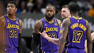 Apr 9, 2025; Dallas, Texas, USA; Los Angeles Lakers forward Rui Hachimura (28) and forward LeBron James (23) and guard Luka Doncic (77) and forward Dorian Finney-Smith (17) during the game between the Dallas Mavericks and the Los Angeles Lakers at American Airlines Center. Mandatory Credit: Jerome Miron-Imagn Images