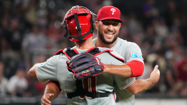 Aug 8, 2024; Phoenix, Arizona, USA; Philadelphia Phillies pitcher Carlos Estevez (53) hugs Philadelphia Phillies catcher J.T. Realmuto (10) after defeating the Arizona at Chase Field. 