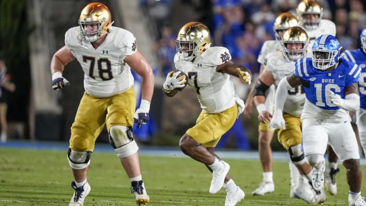 Sep 30, 2023; Durham, North Carolina, USA; Notre Dame Fighting Irish running back Audric Estime (7) follows a block by offensive lineman Pat Coogan (78) against the Duke Blue Devils during the first quarter at Wallace Wade Stadium.