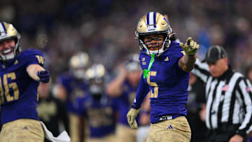 Nov 15, 2025; Seattle, Washington, USA; Washington Huskies wide receiver Omari Evans (5) celebrates after catching the ball against the Purdue Boilermakers during the first half at Husky Stadium. Mandatory Credit: Steven Bisig-Imagn Images