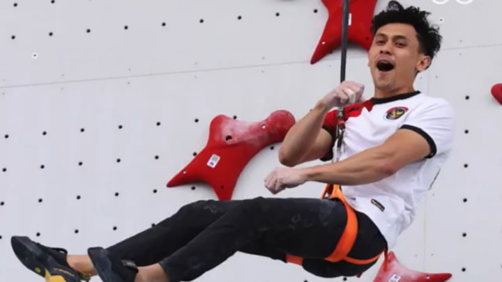 Veddriq Leonardo of Indonesia celebrates winning the country's first gold medal at the Paris Olympics during the men's Speed sport climbing gold medal match at Le Bourget Climbing Venue in Le Bourget, France on Thursday, August 8. 