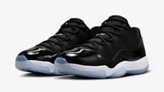 Side view of black and blue Air Jordan sneakers.
