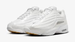 Drake's white and gold Nike sneakers.