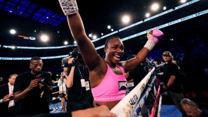 Shields celebrates after defeating Lepage-Joanisse to win heavyweight and light heavyweight titles