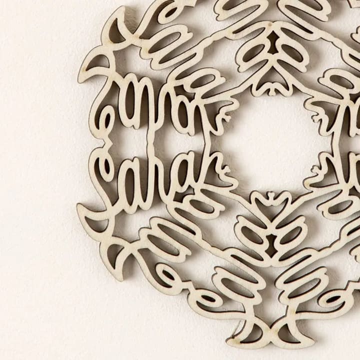 A personalized snowflake ornament is pictured