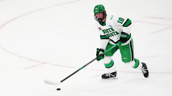 Apr 9, 2026; Las Vegas, Nevada, UNITED STATES; North Dakota Fighting Hawks defenseman Keaton Verhoeff (18) moves the puck in the first period against the Wisconsin Badgers in the semifinals of the NCAA men's ice hockey Frozen Four at T-Mobile Arena. Apr 9, 2026; Las Vegas, Nevada, UNITED STATES; North Dakota Fighting Hawks defenseman Keaton Verhoeff (18) moves the puck in the first period against the Wisconsin Badgers in the semifinals of the NCAA men's ice hockey Frozen Four at T-Mobile Arena.