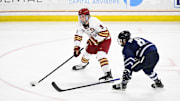 Boston College forward Ryan Leonard shoots the puck against New Hampshire