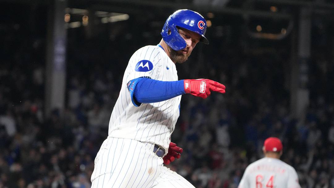 Michael Busch and the Cubs are home favorites against the Reds.