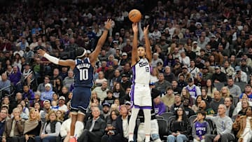 Dec 30, 2024; Sacramento, California, USA; Sacramento Kings forward Keegan Murray (13) shoots against Dallas Mavericks guard Brandon Williams (10) during the fourth quarter at Golden 1 Center. Mandatory Credit: Darren Yamashita-Imagn Images