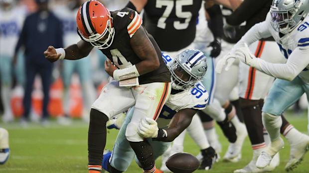 Dallas Cowboys defensive end DeMarcus Lawrence (90) forces a fumble 