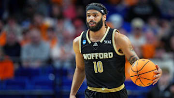 Mar 20, 2025; Lexington, KY, USA; Wofford Terriers guard Corey Tripp (10) brings the ball up court during the first half against the Tennessee Volunteers in the first round of the NCAA Tournament at Rupp Arena. Mandatory Credit: Aaron Doster-Imagn Images