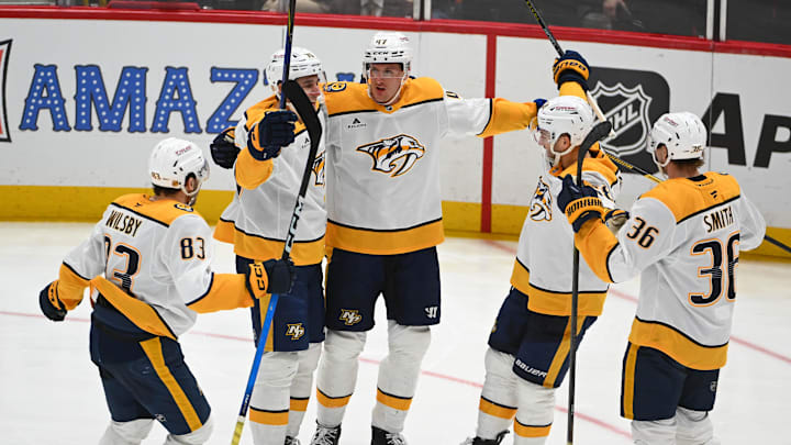Feb 5, 2026; Washington, District of Columbia, USA; Nashville Predators right wing Michael McCarron (47) is congratulated by teammates after scoring a goal against the Washington Capitals during the third period at Capital One Arena. Mandatory Credit: Brad Mills-Imagn Images