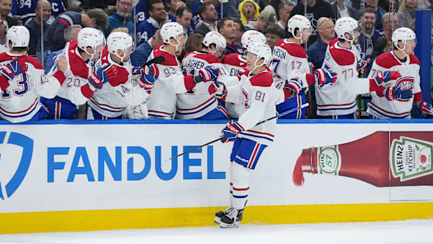 Hockey players celebrate a goa