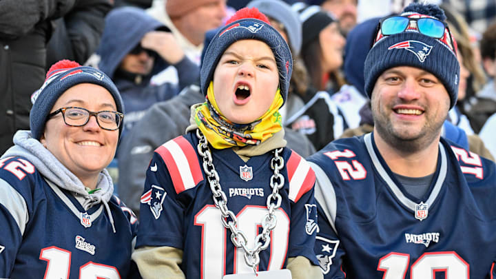 A young New England Patriots fan cheers for the team during the first half against the Indianapolis Colts at Gillette Stadium.