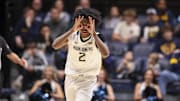 Nov 30, 2025; Morgantown, West Virginia, USA; West Virginia Mountaineers guard Amir Jenkins (2) celebrates a made three pointer during the first half against the Mercyhurst Lakers at Hope Coliseum. Mandatory Credit: Ben Queen-Imagn Images