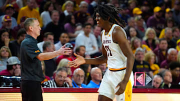 ASU head coach Bobby Hurley high-fives freshman Jayden Quaintance (21).
