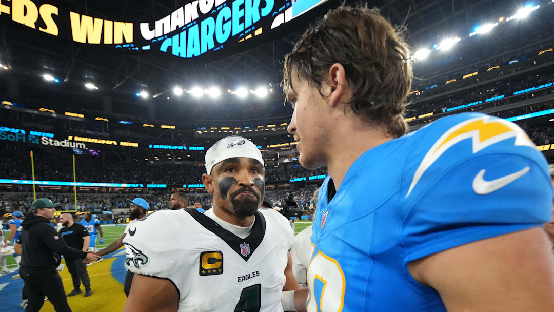 Dec 8, 2025; Inglewood, California, USA; Los Angeles Chargers quarterback Justin Herbert (10) embraces Philadelphia Eagles quarterback Jalen Hurts (1) after the game at SoFi Stadium. Mandatory Credit: Kirby Lee-Imagn Images Dec 8, 2025; Inglewood, California, USA; Los Angeles Chargers quarterback Justin Herbert (10) embraces Philadelphia Eagles quarterback Jalen Hurts (1) after the game at SoFi Stadium. Mandatory Credit: Kirby Lee-Imagn Images