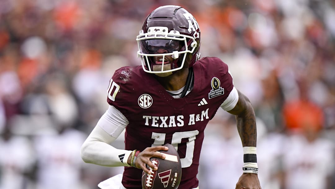 Texas A&M Aggies quarterback Marcel Reed runs with the ball during the game between the Aggies and the Hurricanes at Kyle Field. 