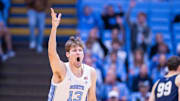 Nov 18, 2025; Chapel Hill, North Carolina, USA; North Carolina Tar Heels center Henri Veesaar (13) celebrates a three point basket against the Navy Midshipmen during the first half at Dean E. Smith Center. Mandatory Credit: Scott Kinser-Imagn Images
