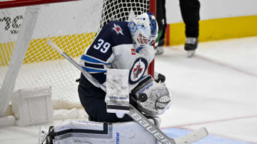 Apr 11, 2024; Dallas, Texas, USA; Winnipeg Jets goaltender Laurent Brossoit (39) makes a save on a Dallas Stars shot during the third period at the American Airlines Center. Mandatory Credit: Jerome Miron-USA TODAY Sports