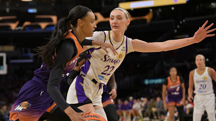 Aug 26, 2025; Los Angeles, California, USA;  Phoenix Mercury forward DeWanna Bonner (14) is defended by Los Angeles Sparks forward Cameron Brink (22) as she drives to the basket during the first half at Crypto.com Arena. Mandatory Credit: Jayne Kamin-Oncea-Imagn Images