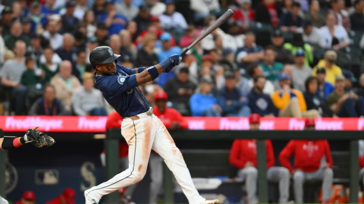 Seattle Mariners center fielder Victor Robles hits a single against the Los Angeles Angels on Monday at T-Mobile Park.