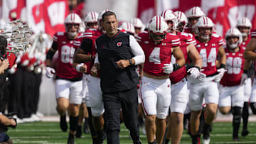 Sep 20, 2025; Madison, Wisconsin, USA;  Wisconsin Badgers head coach Luke Fickell runs onto the field ahead of players prior to the game against the Maryland Terrapins at Camp Randall Stadium. Mandatory Credit: Jeff Hanisch-Imagn Images