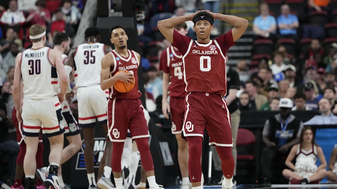 Mar 21, 2025; Raleigh, NC, USA;  Oklahoma Sooners guard Jeremiah Fears (0) reacts during the first half against the Connecticut Huskies at Lenovo Center. Mandatory Credit: Bob Donnan-Imagn Images