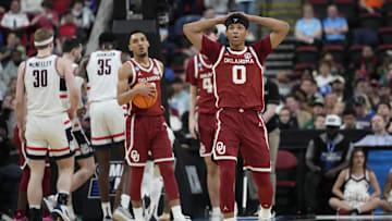 Mar 21, 2025; Raleigh, NC, USA;  Oklahoma Sooners guard Jeremiah Fears (0) reacts during the first half against the Connecticut Huskies at Lenovo Center. Mandatory Credit: Bob Donnan-Imagn Images