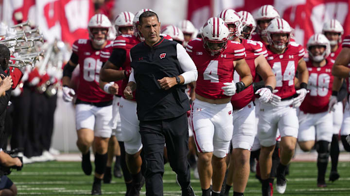 Sep 20, 2025; Madison, Wisconsin, USA; Wisconsin Badgers head coach Luke Fickell runs onto the field ahead of players prior to the game against the Maryland Terrapins at Camp Randall Stadium. Sep 20, 2025; Madison, Wisconsin, USA; Wisconsin Badgers head coach Luke Fickell runs onto the field ahead of players prior to the game against the Maryland Terrapins at Camp Randall Stadium.