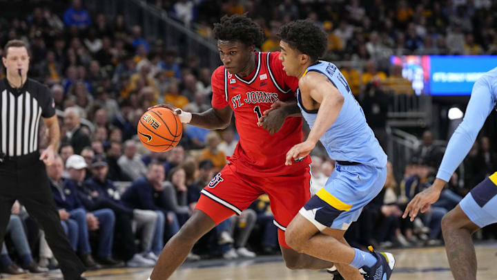 Mar 8, 2025; Milwaukee, Wisconsin, USA;  St. John's basketball guard Kadary Richmond (1) drives for the basket against Marquette Golden Eagles guard Stevie Mitchell (4) during the first half at Fiserv Forum.