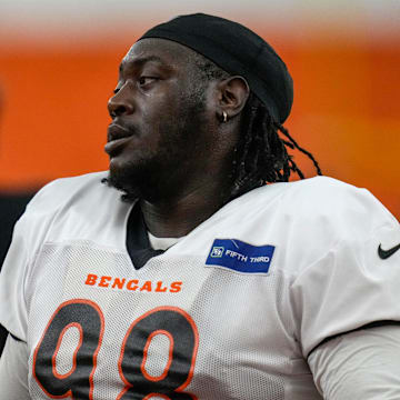 Cincinnati Bengals defensive tackle T.J. Slaton (98) wraps up before a preseason training camp practice in downtown Cincinnati on Thursday, July 31, 2025.