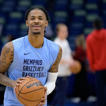 Dec 19, 2023; New Orleans, Louisiana, USA; Memphis Grizzlies guard Ja Morant warms up before a game against the New Orleans Pelicans at the Smoothie King Center. Mandatory Credit: Matthew Hinton-Imagn Images