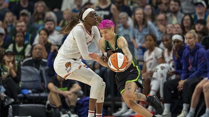 Sep 21, 2025; Minneapolis, Minnesota, USA; Minnesota Lynx guard Natisha Hiedeman (2) dribbles the ball past Phoenix Mercury guard Kahleah Copper (2) in the second half during game one of the second round for the 2025 WNBA Playoffs at Target Center. Mandatory Credit: Jesse Johnson-Imagn Images