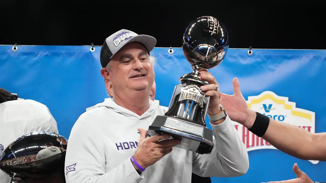 Dec 30, 2025; San Antonio, TX, USA; TCU Horned Frogs head coach Sonny Dykes (left) celebrates after victory over the Southern California Trojan in the Alamo Bowl at Alamodome.