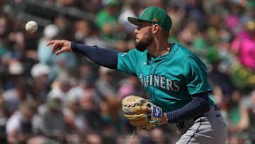 Mar 17, 2025; Mesa, Arizona, USA; Seattle Mariners pitcher Casey Lawrence throws against the Oakland Athletics in the third inning at Hohokam Stadium. Mandatory Credit: Rick Scuteri-Imagn Images
