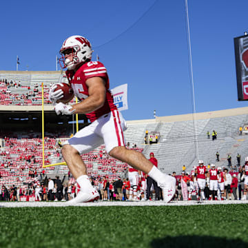 Oct 5, 2024; Madison, Wisconsin, USA;  Wisconsin Badgers running back Cade Yacamelli (25) warms up prior to the game against the Purdue Boilermakers at Camp Randall Stadium. 