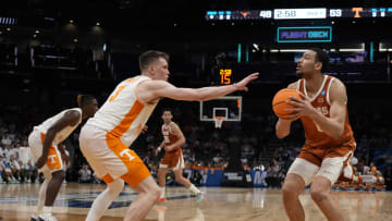 March 23, 2024, Charlotte, NC, USA;  Texas Longhorns forward Dylan Disu (1) is defended by Tennessee Volunteers guard Dalton Knecht (3) in the second round of the 2024 NCAA Tournament at the Spectrum Center. Mandatory Credit: Jim Dedmon-USA TODAY Sports